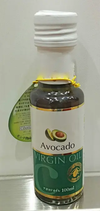 bottle of avocado virgin oil with avocado graphic and japanese text labels, presented as a healthy cooking oil option