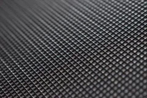 close-up 3d mesh fabric texture with interlaced grid pattern and dimensional depth