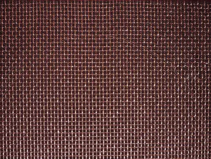 close-up of woven copper-infused fabric with metallic fiber grid pattern