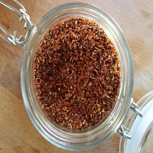 close-up top-down view of flax seeds in a glass jar (flax seeds bowl)