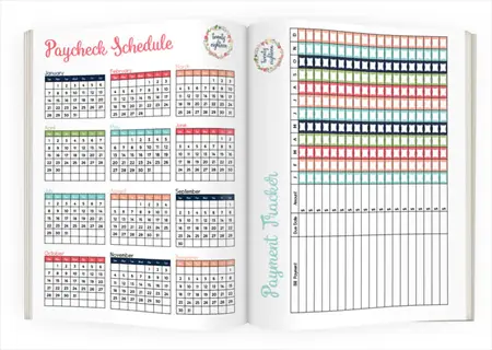 colorful open bullet journal showing annual paycheck schedule with monthly calendars and a detailed payment tracker grid for financial progress monitoring