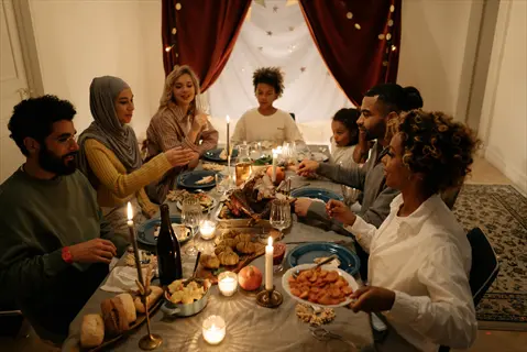 diverse family sharing joyful conversation during a candlelit dinner - cultivating human connections