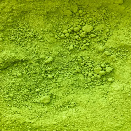 matcha powder close-up showing textured surface with green clumps