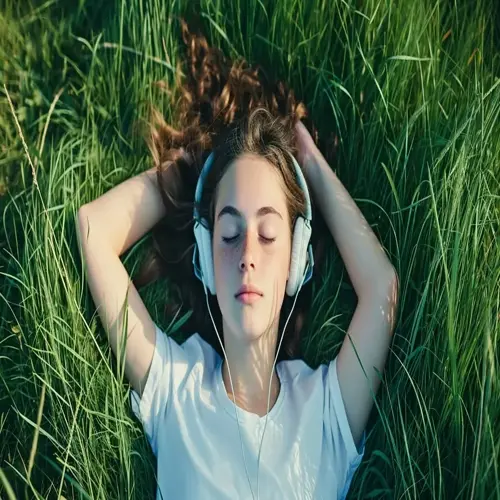 person relaxing in lush green grass with headphones, eyes closed, immersed in calm music relaxation