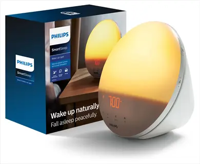 philips smartsleep wake-up light with packaging box showing 'wake up naturally' text and person in bed (face visible)
