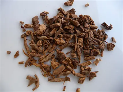 pile of dried valerian root fragments on white surface
