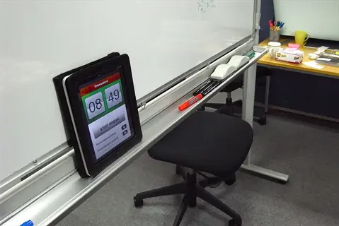 pomodoro tomato timer on office desk showing 08:49 countdown with stop break button