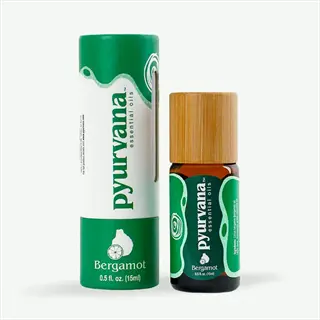 pyurvana essential oil bergamot bottle (0.5 fl. oz.) with bamboo cap and matching cylindrical packaging featuring citrus design on white background