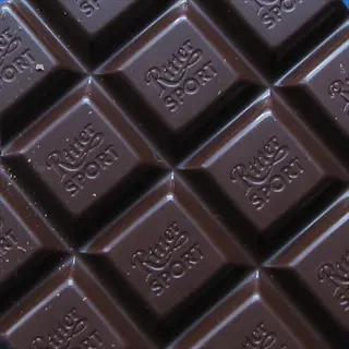 ritter sport dark chocolate squares in grid pattern with embossed branding