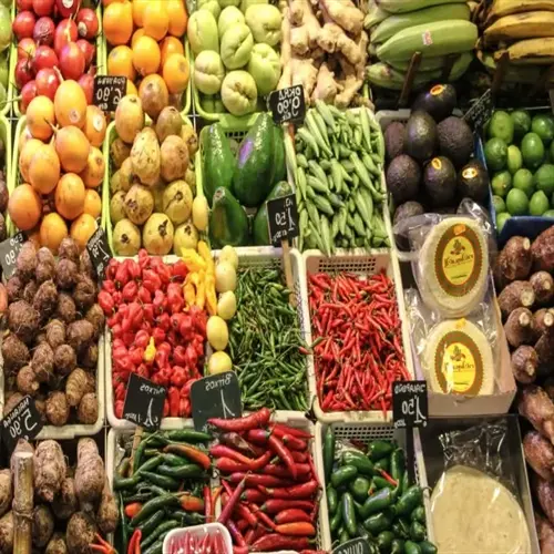 vibrant organic food basket display at a market featuring fresh fruits and vegetables in crates with visible price tags