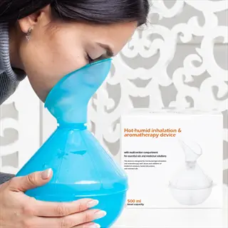 woman using blue essential oil steam inhalation device for respiratory aromatherapy with product packaging (500 ml capacity)